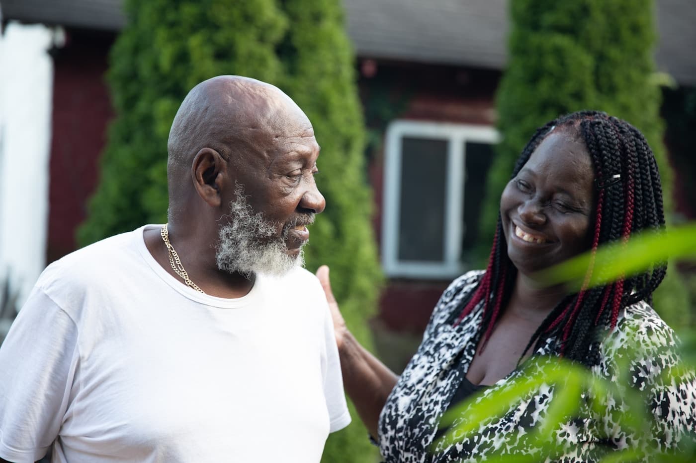 Retired couple laughing together at home - life and retirement cover from Mufasa Insurance